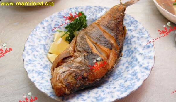 ماهی سرخ شده با کره و لیمو